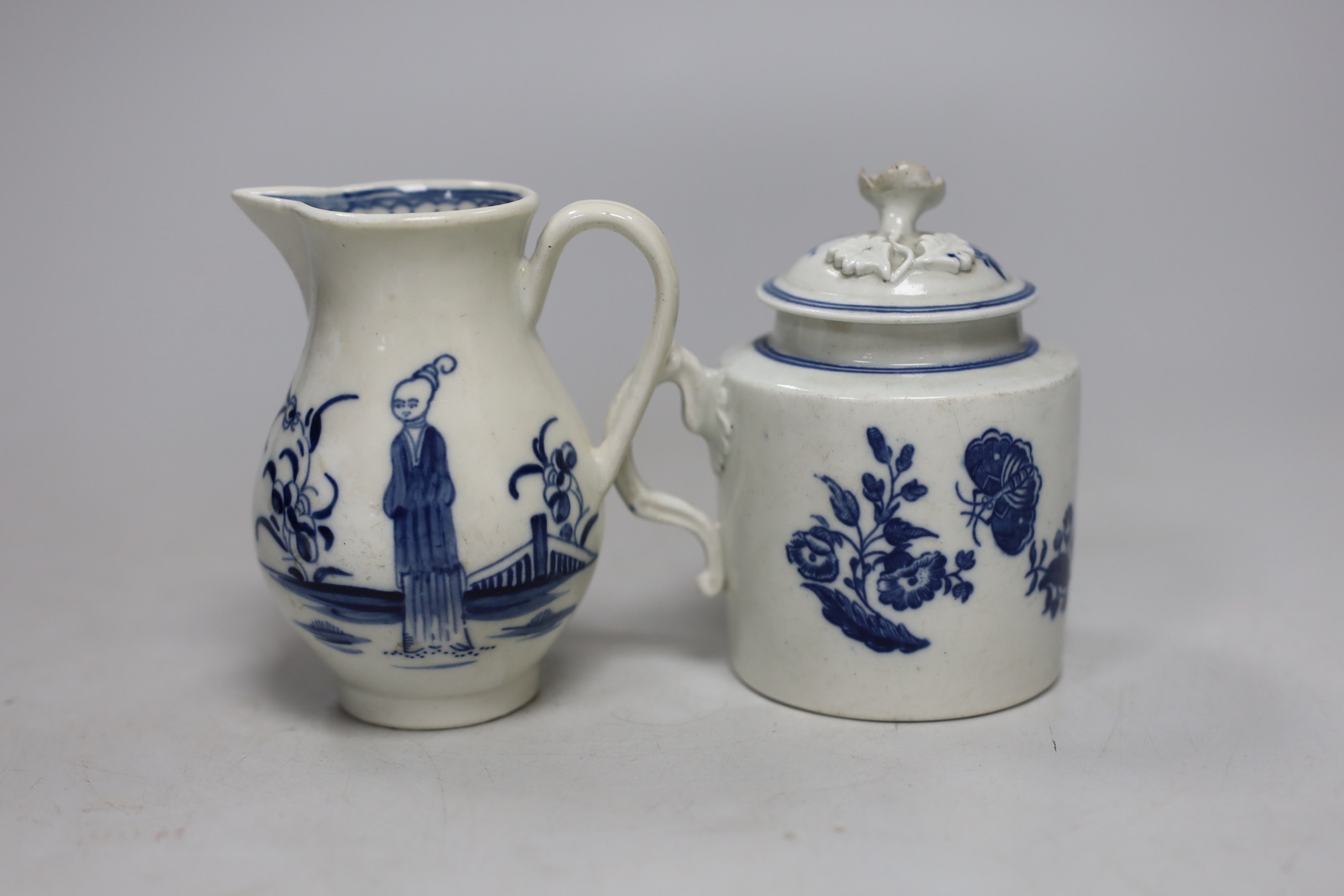 An 18th century Caughley rare sparrowbeak jug painted with the Waiting Chinaman pattern, handle repaired and a Caughley mustard pot and cover with Three Flowers, jug 9cms high